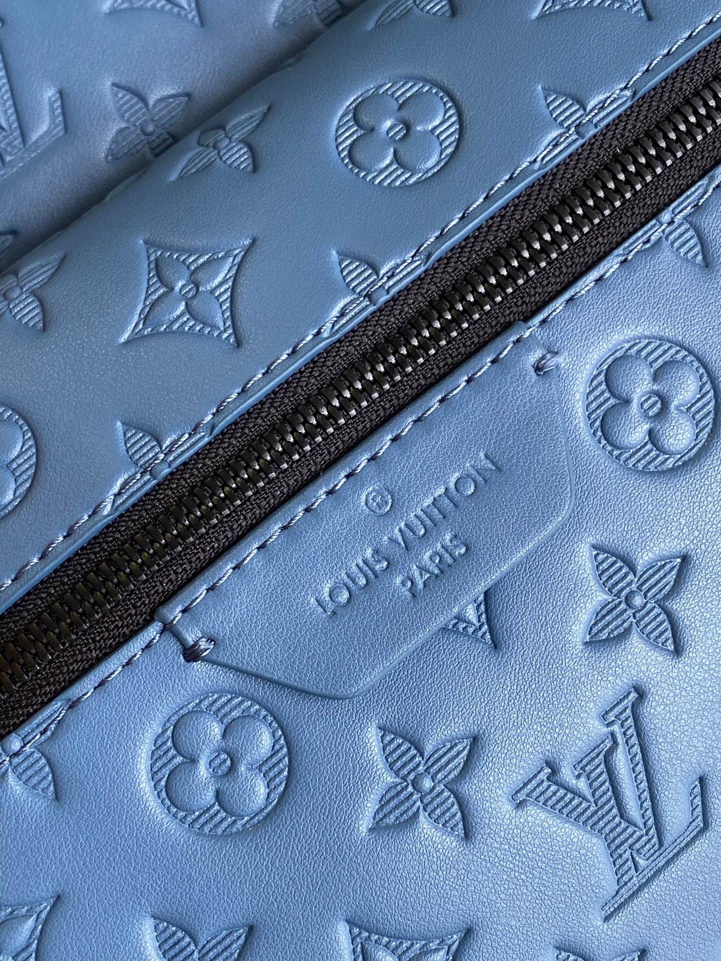 Top-Tier blue emboss Discovery Backpack