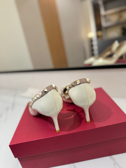 1:1 Valentino Classic Heels with Side Cutouts and Studded Design
