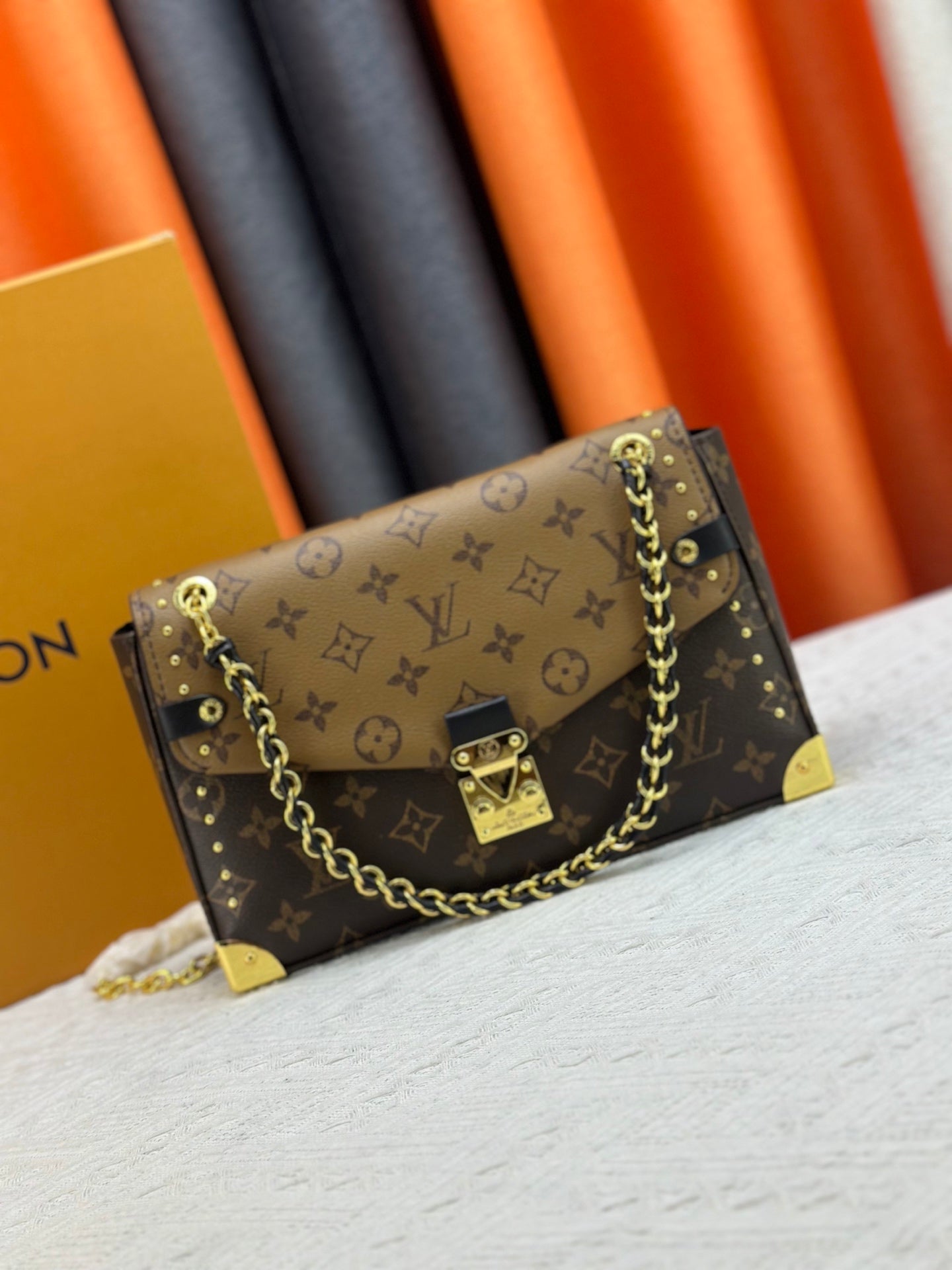 Top-quality Monogram Trunkie combines