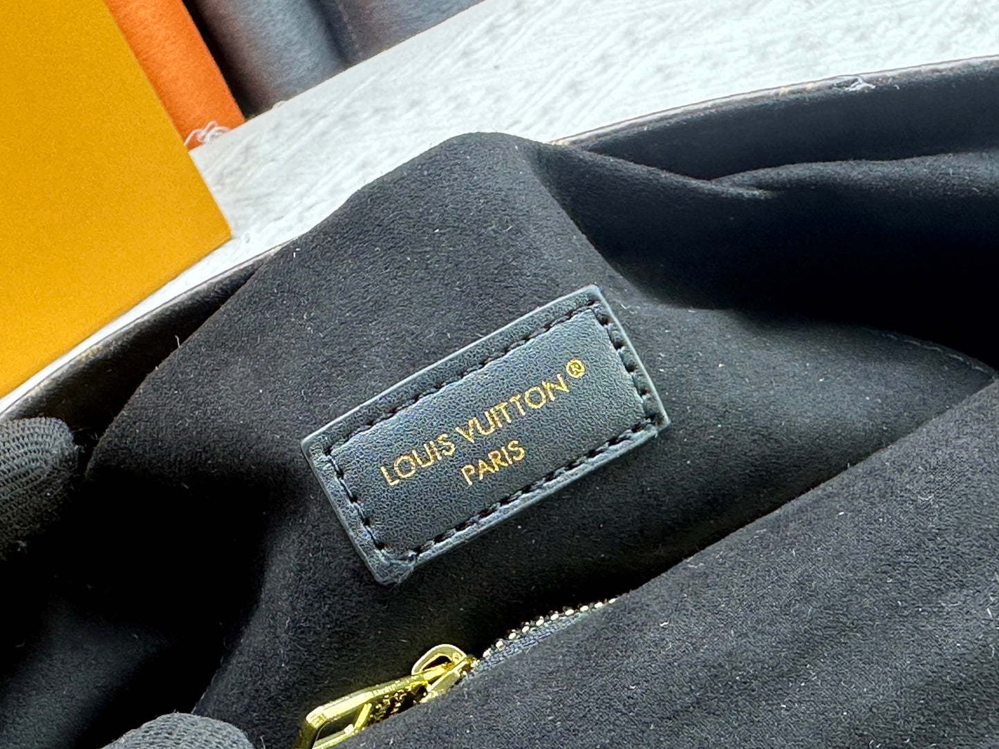 Top-quality Monogram Trunkie combines